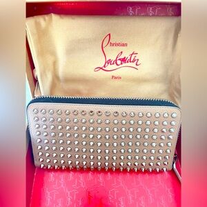 Christian Louboutin long zippy wallet . Preowned. in excellent condition.